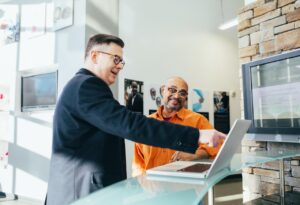 Two employees go over KPIs in the workplace